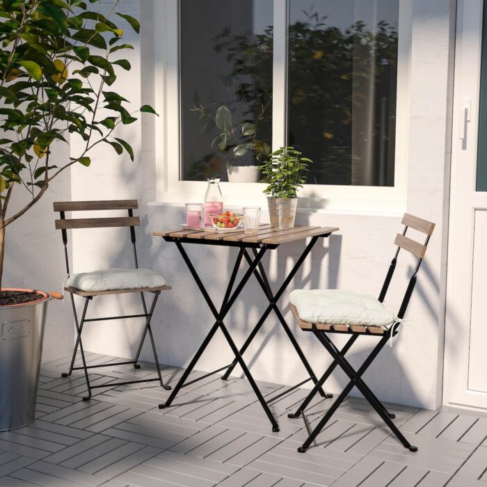taernoe table 2 chairs outdoor black light brown stained kuddarna beige 0667583 pe713986 s5 1 1